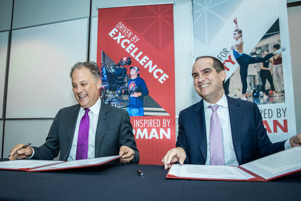 Chapman University President Matt Parlow and Marymount Education Foundation Chair of Board Rick Elder sign partnership agreement.