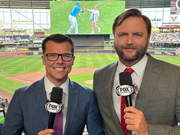 Jeff Levering (left) and fellow broadcaster get ready to call a baseball game.