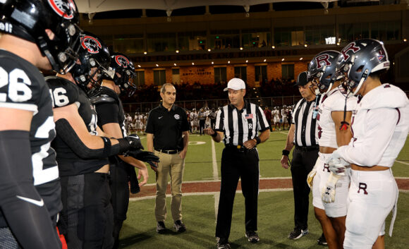 Matt Parlow doing the coin toss at Chapman Family Homecoming 2025