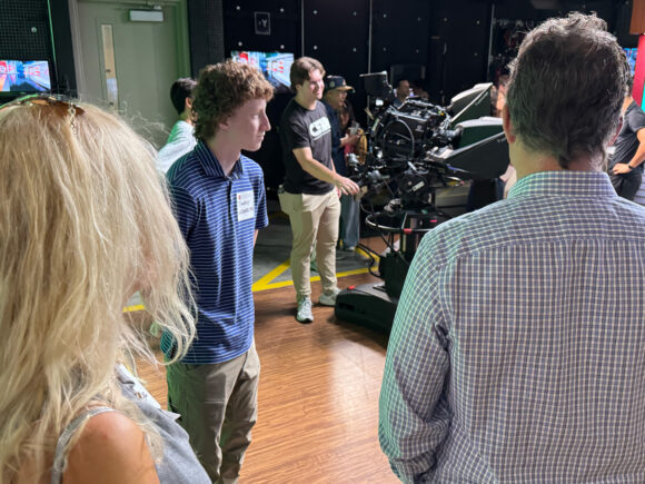 Timothy Lindenfelser and parents tour television production studio at Dodge College.