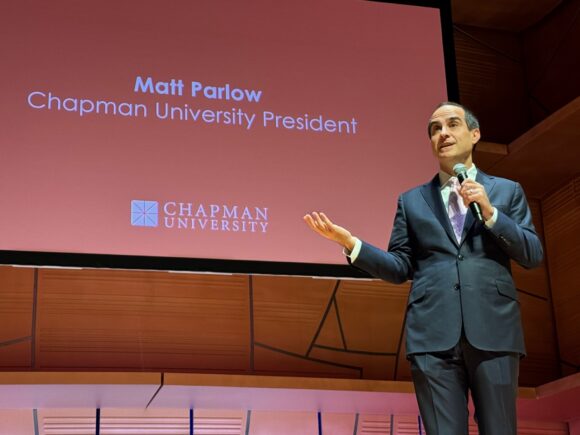 Matt Parlow on stage welcoming students to Open House.