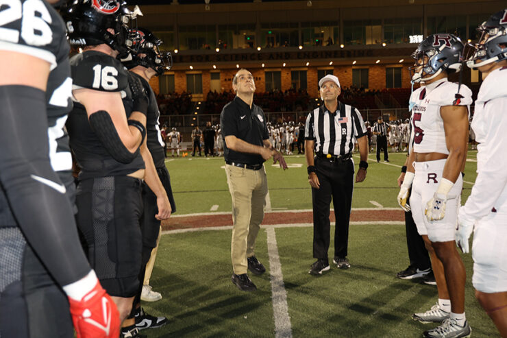 parlow tossing coin on football field