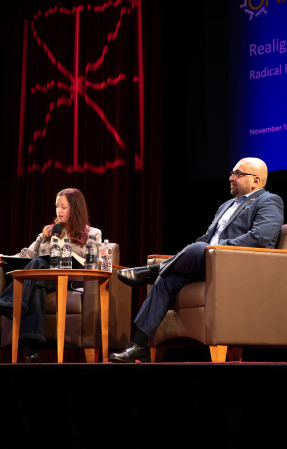 Dr. Vikki Katz and Ahmed Fouad Alkhatib on stage. 