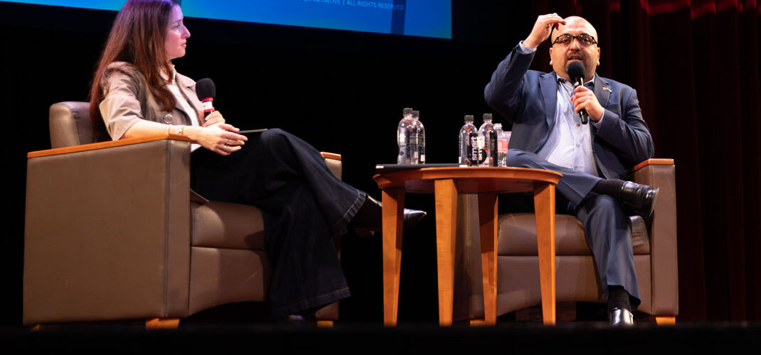 Dr. Vikki Katz and Ahmed Fouad Alkhatib on stage.