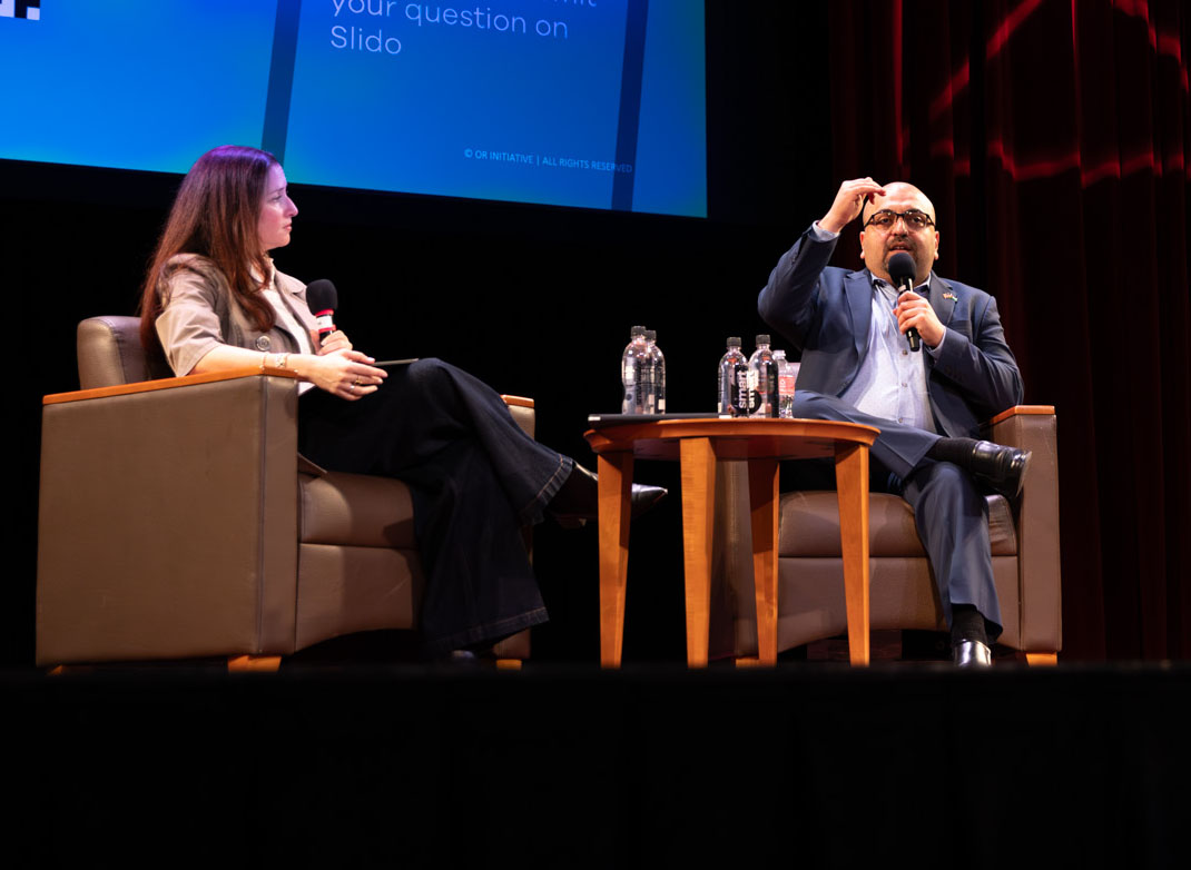 Dr. Vikki Katz and Ahmed Fouad Alkhatib on stage.