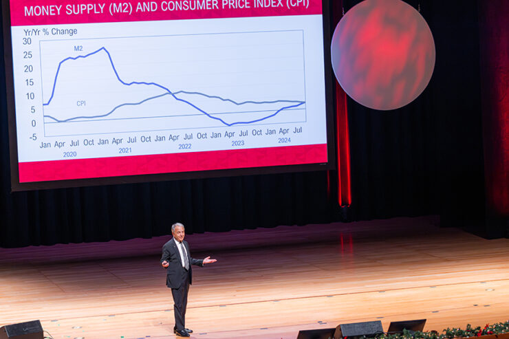 james doti on stage before projected chart