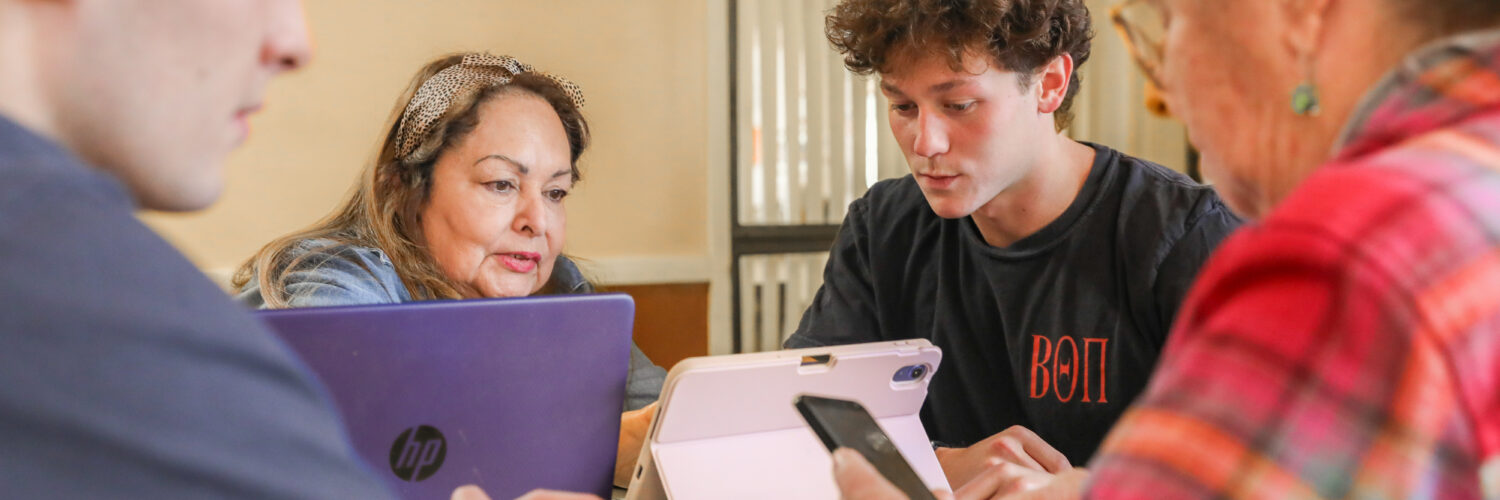 Members of Beta Theta Pi lending their tech skills, and their time to local seniors.