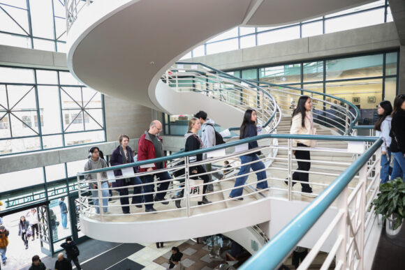 Admitted students and families tour Argyros Forum.