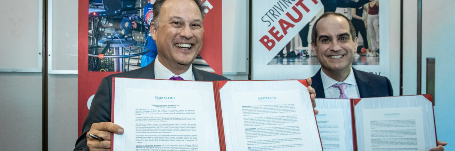 Chapman University President Matt Parlow and Marymount Education Foundation Chair of Board Rick Elder sign partnership agreement.