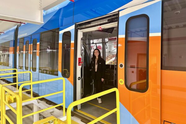 Megan Abbas stands in an OC Streetcar.
