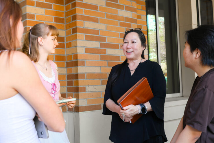 Associate Professor Stephanie Takaragawa meets with students.
