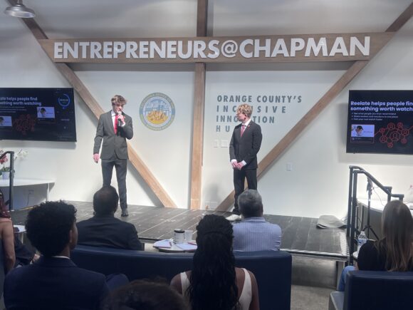 From left, Brady Fisher and Zach Lipfield present their winning startup, Reelate.