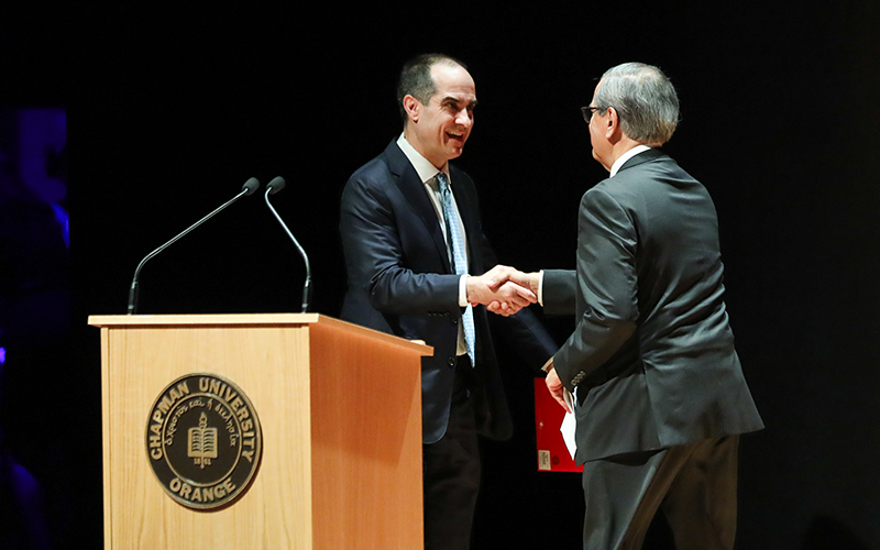 Ambassador Gaddi Vasquez introduces Chapman President Matt Parlow at the Orange State of the City event