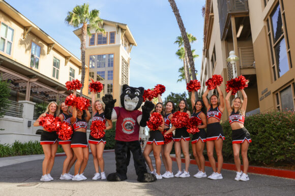 Pete the Panther stands with the Chapman Cheer Squad outside the Jim Miller Parking Structure on Move-In Day.