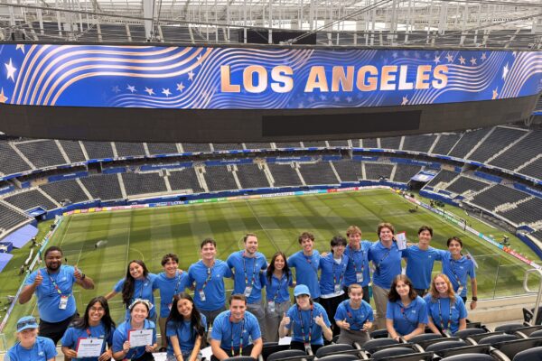 Chapman student interns post in SoFi Stadium