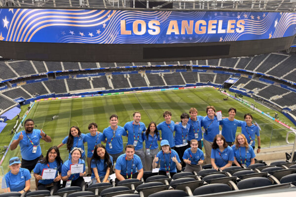 Chapman student interns post in SoFi Stadium
