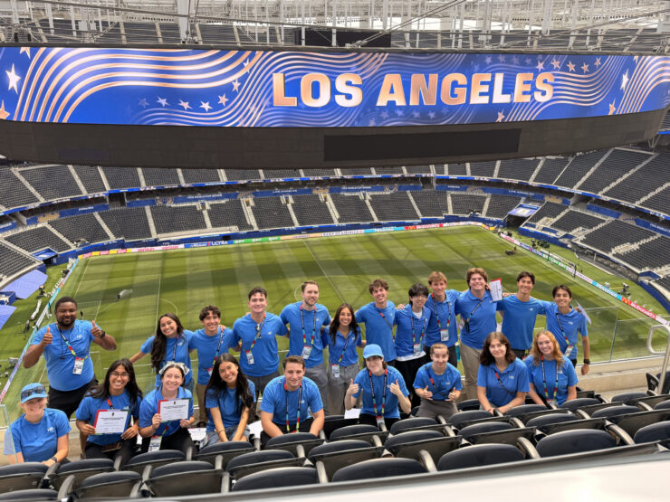 Chapman student interns post in SoFi Stadium