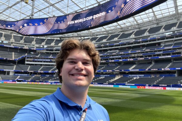 Zach Woodford smiles on the field at SoFi Stadium.