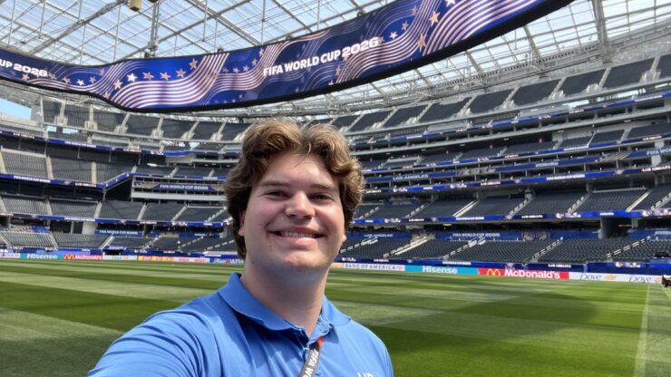 Zach Woodford smiles on the field at SoFi Stadium.