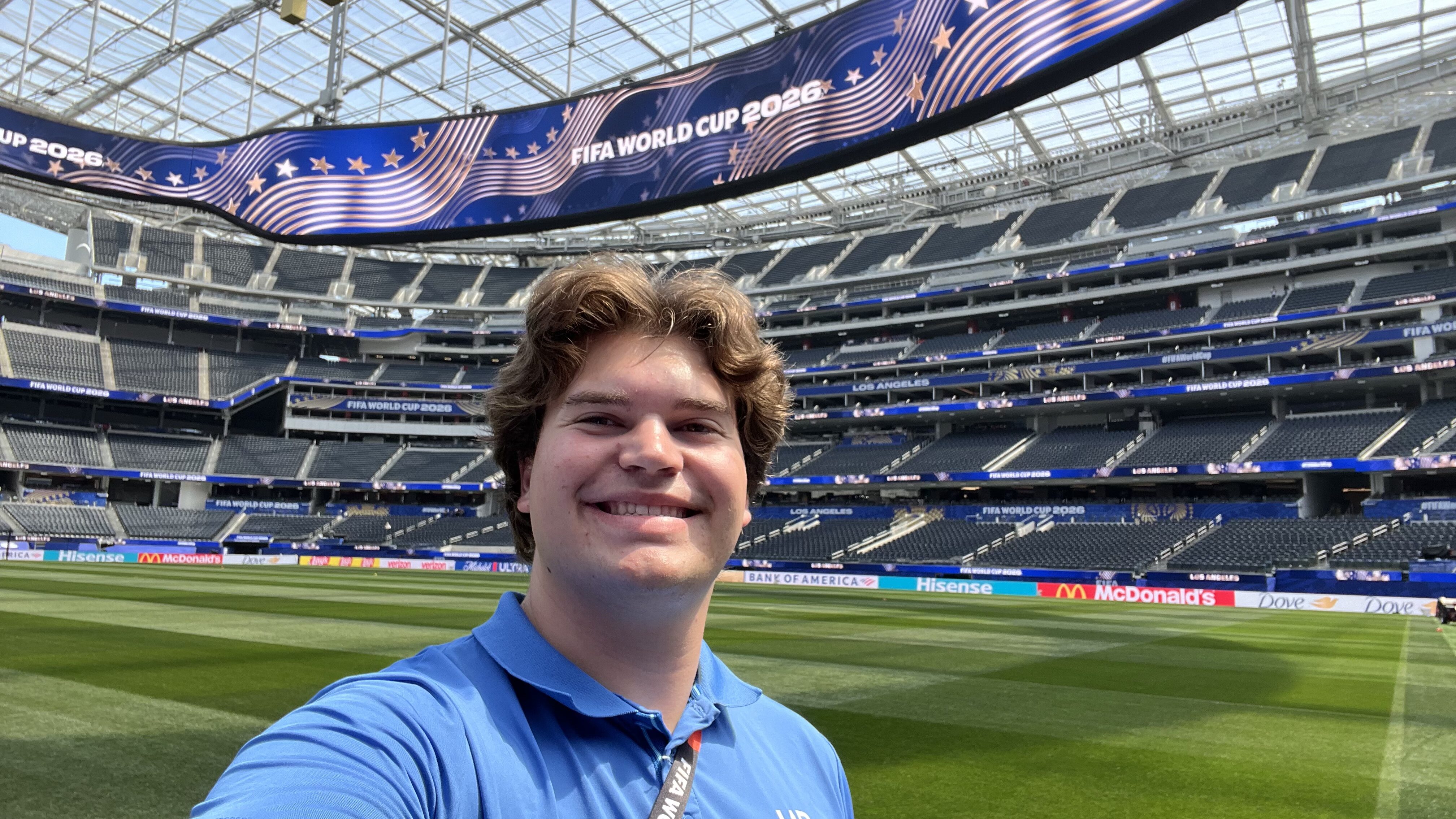 Zach Woodford smiles on the field at SoFi Stadium.