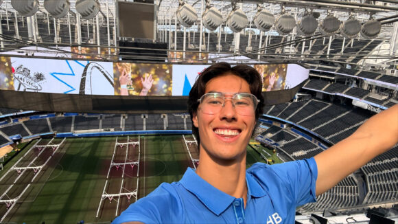 Nico Schwegler smiles with an empty SoFi Stadium behind him.