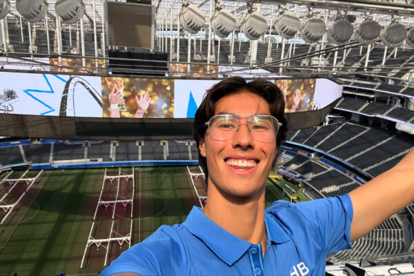 Nico Schwegler smiles with an empty SoFi Stadium behind him.
