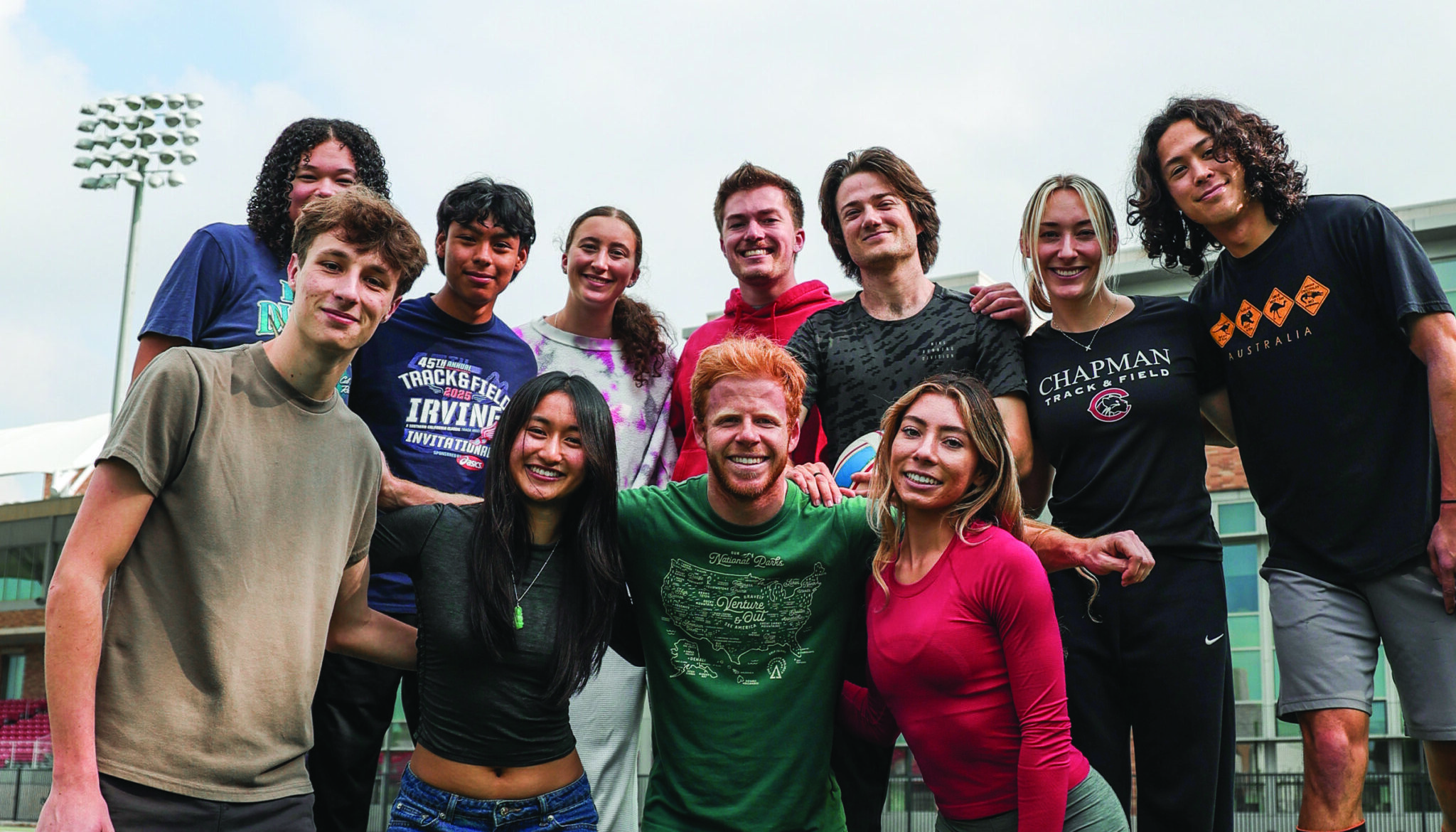 Eleven Chapman students pose together on the turf at Wilson Field.
